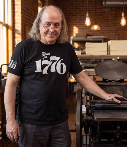 Benjamin Franklin wearing The Answer To 1984 Is 1776 T-Shirt in black