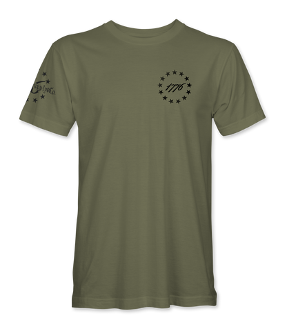 The Alex Jones Store - Front of olive green 1776 America Supply Co t-shirt with small left-chest Betsy Ross ring and 1776 numerals