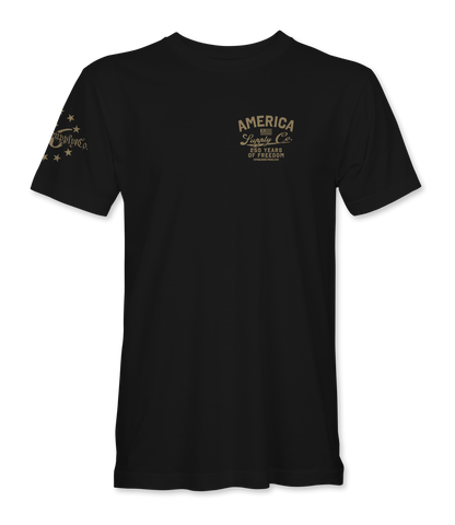 The Alex Jones Store - Front of black America Supply Co 250 Years Of Freedom t-shirt with small tan left-chest logo and stars sleeve print