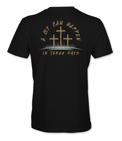 The Alex Jones Store - Back view of black 'A Lot Can Happen In Three Days' t-shirt with three crosses on a hill and tan script Easter design