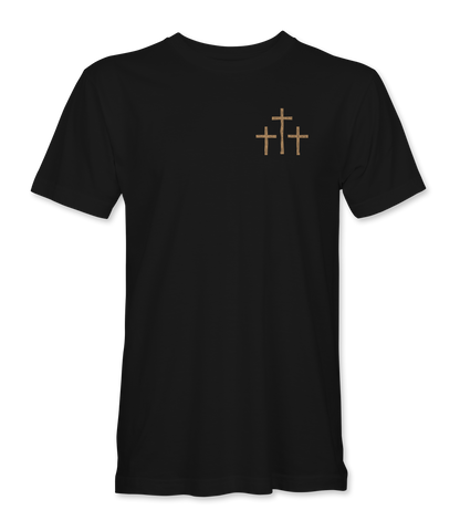 The Alex Jones Store - Front of black 'A Lot Can Happen In Three Days' t-shirt with small tan three-crosses graphic at left chest