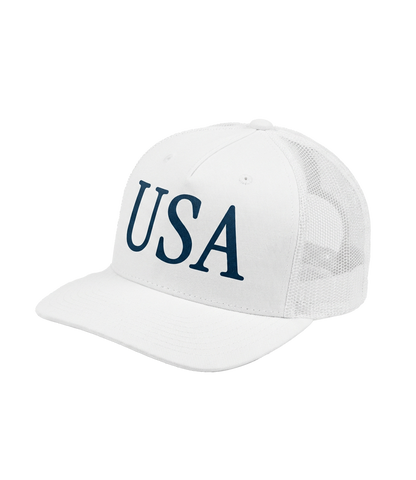 The Alex Jones Store - White 'USA' Premium Trucker Hat with navy serif USA logo, side-angle view showing mesh back and curved bill