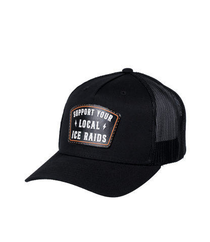 The Alex Jones Store - Black trucker hat three-quarter view with 'Support Your Local ICE Raids' leather patch on front and mesh back
