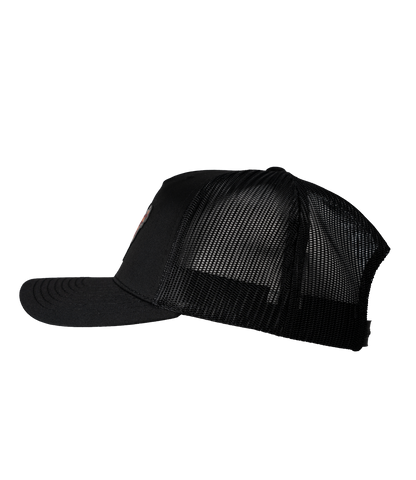 The Alex Jones Store - Left side view of all-black Deus Vult Patriot's Crest trucker hat with black mesh back and pre-curved visor