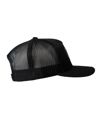 The Alex Jones Store - Right side view of black Deus Vult Patriot's Crest trucker hat showing black mesh back and USA flag-cross patch