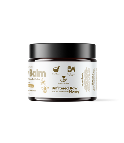 Alex Jones Naturals - Optimal Human - Grass-Fed Tallow Balm With Raw Honey (2 oz) — Side label of Optimal Human Tallow Balm showing unfiltered raw natural wildflower honey and small-batch USA badges