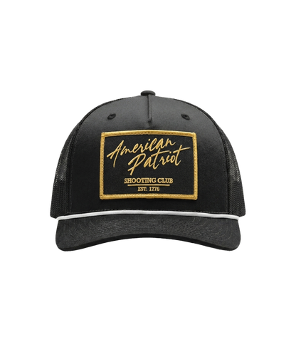 The Alex Jones Store - Front of black American Patriot Shooting Club hat with gold-bordered stitched patch, white rope and black mesh back