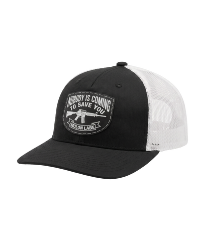The Alex Jones Store - Side angle of black and white Nobody Is Coming To Save You trucker hat showing pre-curved visor and white mesh back panel